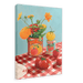 Framed artwork titled "You Say Tomato I Say Wolf Peach" by Hôtel Dodo, featuring nightshade flowers in a tomato can, a jar of strawberry preserves, a fresh tomato, and strawberries displayed on a red and white checkered tablecloth.