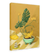 The Ikebana Banana Giclée Canvas Print by Hôtel Dodo showcases tropical foliage, yellow flowers, bananas in a bowl, a figurine, and a key tag labeled "Hôtel Dodo," all arranged on a striped surface set against a mustard-yellow background.