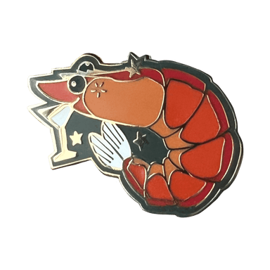 The Prawn Cocktail Pin by Pins by diedododa features an orange prawn with a star-topped wand, surrounded by small stars on a black background, capturing the charm of a whimsical cocktail party.