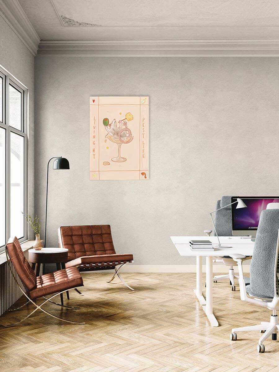 A modern office with two brown chairs, a round table, and a desk with computers boosts creativity. The "Living my Pest Life Matte Canvas Print" by International Pestsellers brightens the neutral-toned wall. Large windows provide natural light, perfect for inspiration or goblin mode.