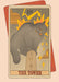 The Tower Art Print by Tarot Cats features an angry gray cat on a pedestal struck by yellow lightning bolts, with the Roman numeral XVI above.
