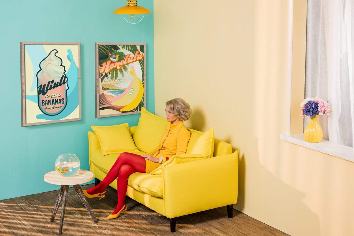 A woman wearing yellow sitting on a yellow sofa